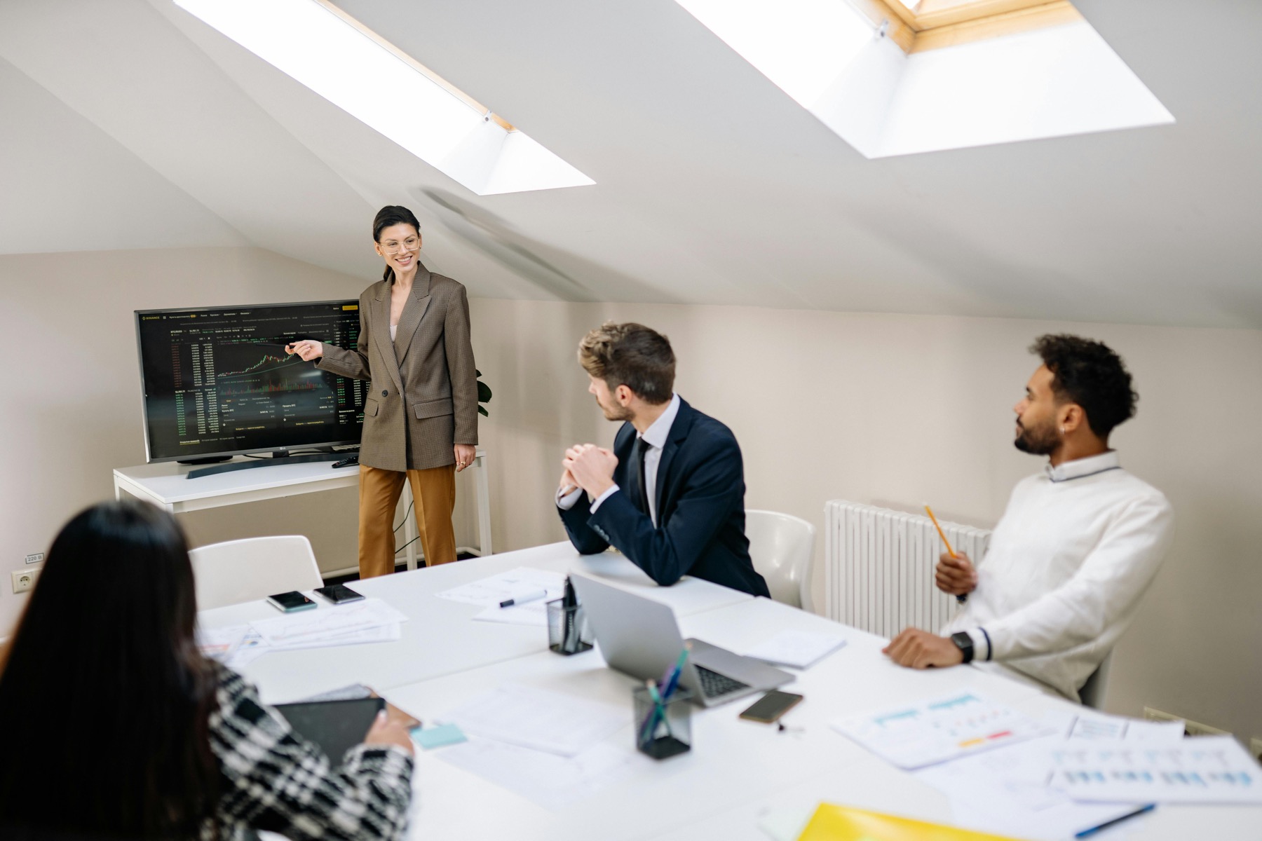 Finance team reviewing a boardroom presentation
